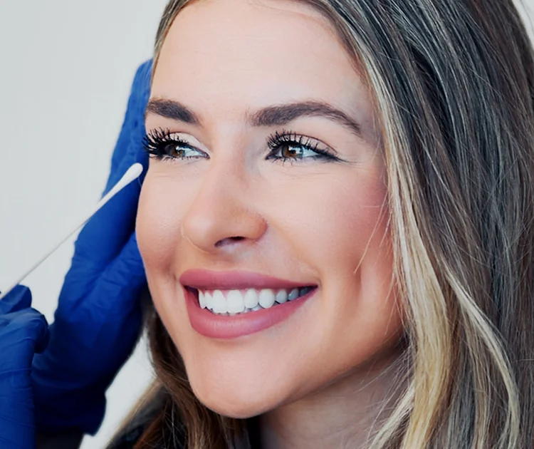 beautiful woman receiving facial treatment