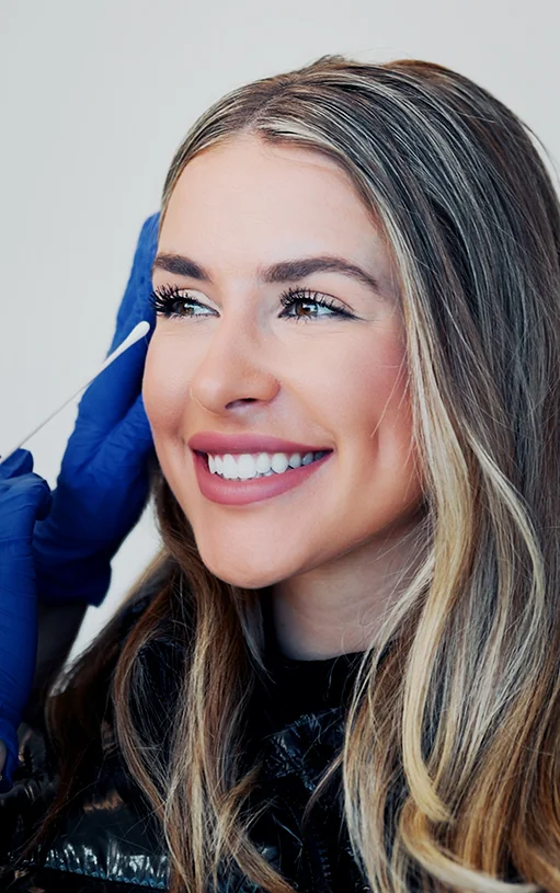 beautiful woman receiving facial treatment