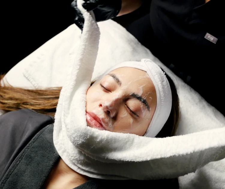 Woman receiving a facial at MyEvergreen Med Spa