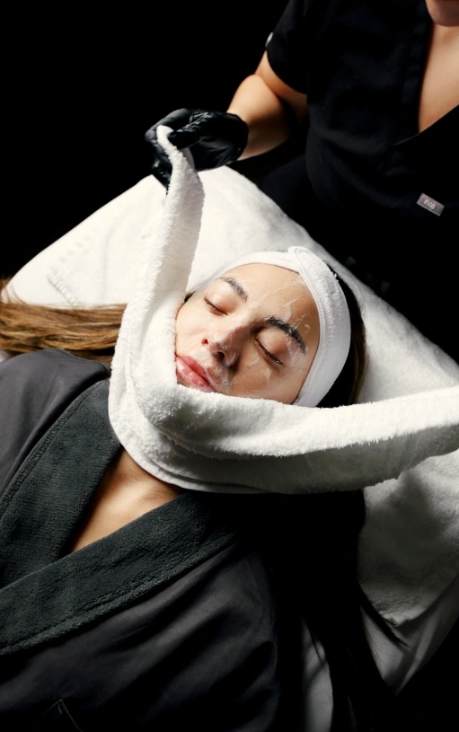 Woman receiving a facial at MyEvergreen Med Spa
